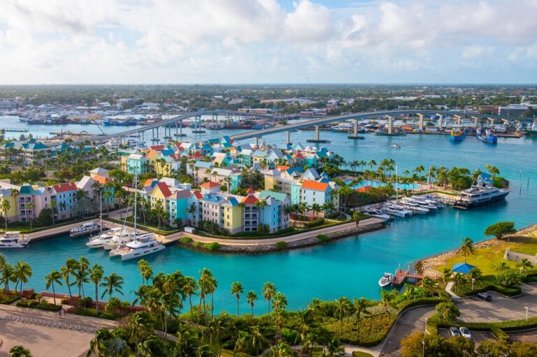Escale à Nassau, un coin de paradis 9 Harborside Villas aerial view at escale à Nassau Harbour with Nassau downtown at the background, from Paradise Island, Bahamas.